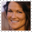 Static 48x48 pixel icon showing a close-up of a person's face with dark hair and warm skin tones, framed by a white border with gray corner markers.