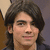 A person with long dark hair and a neutral expression appears in four -aligned , each showing subtle variations in head position and background color