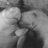 Black-and-white pixelated image of two figures in close embrace with visible hands and partial faces, surrounded by repeated text elements.