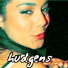 A close-up profile view of a person with teal hair, red lips, and blue eyeshadow, with the text "hvdgens" overlaid in white script font.