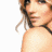 A pixelated image of a woman with light brown hair in a black strap top, showing three views: front-left, side, and back-right.