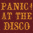 Maroon background with golden text reading "PANIC! AT THE DISCO" and "A FEVER YOU CAN'T SWEAT OUT", featuring a pixelated band image below the text.