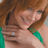 Static 48x48 pixel icon showing a close-up of two people embracing, with visible brown hair and green clothing details against a light background.
