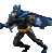 Pixelated figure in blue and black costume with cape, orange belt, and glowing chest emblem, posed dynamically against gray background.