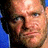 Pixelated close-up of a person's face with visible facial features and partial background elements.