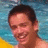 A pixelated image of a smiling person in a pool with blue water and yellow object, alongside text on blue and gray backgrounds.