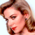 Pixelated close-up of a person with light brown hair, closed eyes, and red lips against a white background.