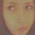 Static pixelated image of a human face with blurred features, showing eyes and part of the nose against a muted background.