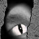 A grayscale animated eye with a vertical bar of static between showing the eye's pupil shifting left to right