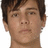 Pixelated close-up of a person's face with brown hair, neutral expression, and visible neck against white background.