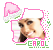 Pixelated image of a person with brown hair wearing a white hat and pink Santa hat, smiling with text 'CAROL' below in green and pink letters.