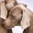 Pixelated image of two figures in close physical contact with visible facial features and partial clothing details.