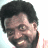 Pixelated image of a smiling person with dark curly hair against light background, blue text "Sexy" and "OriginalIcons.com" on black