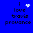 Blue background with black text reading 'i love travis provance' and a white pixelated heart symbol above the word 'love', which changes to a starburst then a scattered dot pattern before returning to static.
