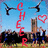 Pixelated image with red text spelling 'CHEER' vertically, two black-and-white airplane silhouettes, a pink heart outline, and a building silhouette against a blue sky.