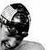 Black-and-white animated icon shows a shirtless person with short dark hair wearing goggles, transitioning from side profile to front view.