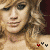 A pixelated image of a person with light brown hair and fair skin, wearing no visible clothing, with two small red symbols at the bottom center.