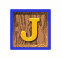A wooden block with a yellow 'J' on a blue border, transitioning through multiple 3D cube views showing different colored 'J' letters on brown wooden faces.