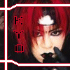 A person with red hair and dark makeup holds a black glove near their mouth, framed by a of four with red and white symbols