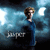 A person with curly light brown hair in a blue dress stands against a cloudy sky background, with the word 'super' visible below.