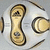 Animated icon shows a white and gold soccer ball with black lines, featuring an Adidas logo on one and a small circular emblem on another