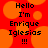 Red background with orange circular shapes and black pixelated text reading "Hello I'm Enrique Iglesias !!!" in two identical