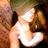 Pixelated image of two figures in close physical contact with visible skin tones and partial clothing, set against a dark background.
