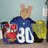 A pixelated cartoon mouse wearing a blue jacket stands behind a red and white object with large white numbers '80' on a blue background.