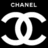 Black background with white stylized interlocking 'C' symbols and pixelated text above reading 'CHANEL' in grayscale.
