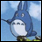 Blue cartoon creature with large ears and white belly stands against light blue sky with white clouds, right side shows black background with white text "AnimeIM" and "com".