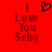 Red background with pixelated text "I Love You Seby" and a black heart symbol above the left side of the text.