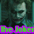 A pixelated image of a character with greenish skin and dark hair, featuring text overlays in bright colors.