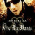 Pixelated image of a person with light skin and dark hair wearing a black top, set against a warm-toned background with visible text below.