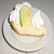A split-screen image with a plate of pie on the left and green background text reading 'my key lime pie' on the right.