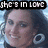 Two pixelated faces with text overlays reading "she's in love" and "with the boy", one on each side of a split composition.