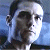 Pixelated close-up of a person's face with dark hair, visible ear, and light blue background, rendered in low-resolution digital style.