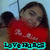 Pixelated image of a person in red clothing with visible text at the bottom, set against an outdoor background.