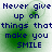 Pixelated text reads "Never give up on things that make you SMILE" in dark blue over a green and white gradient background with four identical