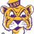 Pixelated cartoon character with yellow fur, purple accents, and large white eyes with black pupils, wearing a yellow cap and holding a purple object.