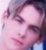 Pixelated close-up of a person's face with closed eyes, pink and purple color palette, visible eyelashes, lips, and partial hair.