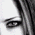 Static 50x50 pixel icon featuring a stylized black musical note with gray and white highlights on a transparent background, surrounded by scattered pastel-colored pixels.